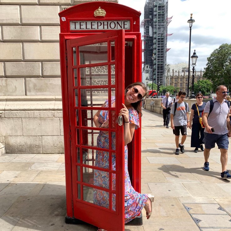 Posing in front of red telephone booth