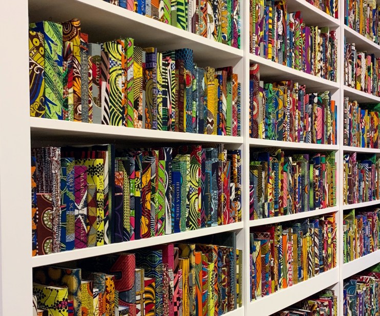 Vibrant patterned book covers on a bookshelf